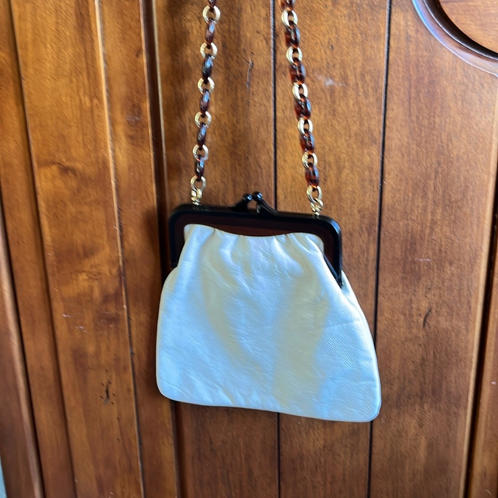 Gently used small white leather Acloria purse w/ lucite type snap closure/handle